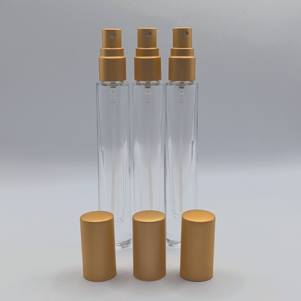 Source Unknown Gold and Clear Skincare Spray Bottles